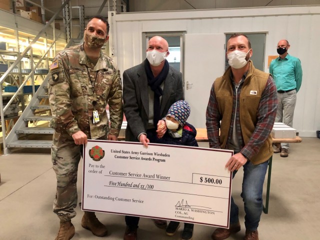 WIESBADEN, Germany – William Kavanagh, environmental engineer with the Directorate of Public Works, receives his customer service award Dec. 18, 2020 at his U.S. Army Garrison Wiesbaden workplace. Photo by Brittany Casey.
