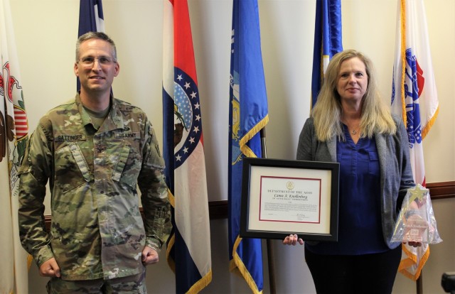 Col. Steve Sattinger, U.S. Army Corps of Engineers, Rock Island District Commander, presents Camie Knollenberg, St. Paul District plan formulation branch chief, with the Supervisor of the Year award, in Rock Island, Illinois, Aug. 5.