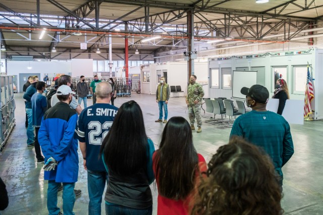 WIESBADEN, Germany – Col. Mario Washington, garrison commander, offers words of praise to the postal workers prior to issuing the first customer service award Dec. 18, 2020.