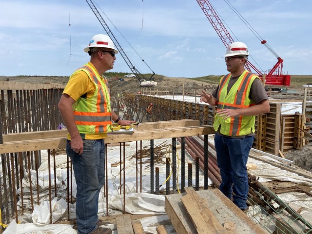 Duane Perkins, U.S. Army Corps of Engineers, St. Paul District structural engineer, and Greg Hammons, U.S. Army Corps of Engineers, St. Paul District construction representative, stand at the Fargo-Moorhead Metro Diversion Inlet structure, near...