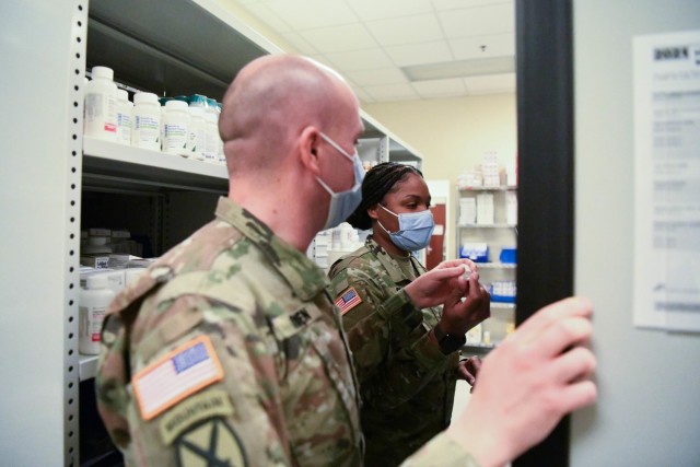 U.S. Army Health Center Vicenza Pharmacy Officer in Charge Maj. Sean O&#39;Brien and Noncommissioned Officer in Charge Sgt. La&#39;Terra Cook review stocked medications Dec. 31, 2020 in Vicenza, Italy. USAHC-V is ready to receive the COVID-19 vaccine for administration to the community. 