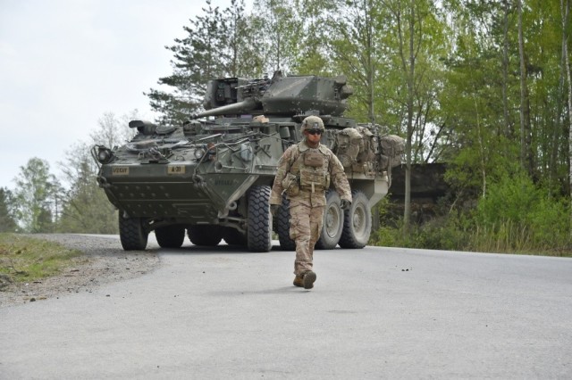 U.S. Army Sgt. Eustorgio Muniz, Apache Troop, 1st Squadron, 2nd Cavalry Regiment (2/CR) ground guides a Stryker 30mm Infantry Carrier Vehicle – Dragoon during the squadron’s Stryker crew gunnery at the 7th Army Training Command’s Grafenwoehr Training Area, Germany, April 26, 2019.  The 2/CR will be the first Stryker brigade combat team equipped with Capability Set 21 Integrated Tactical Network capabilities. 