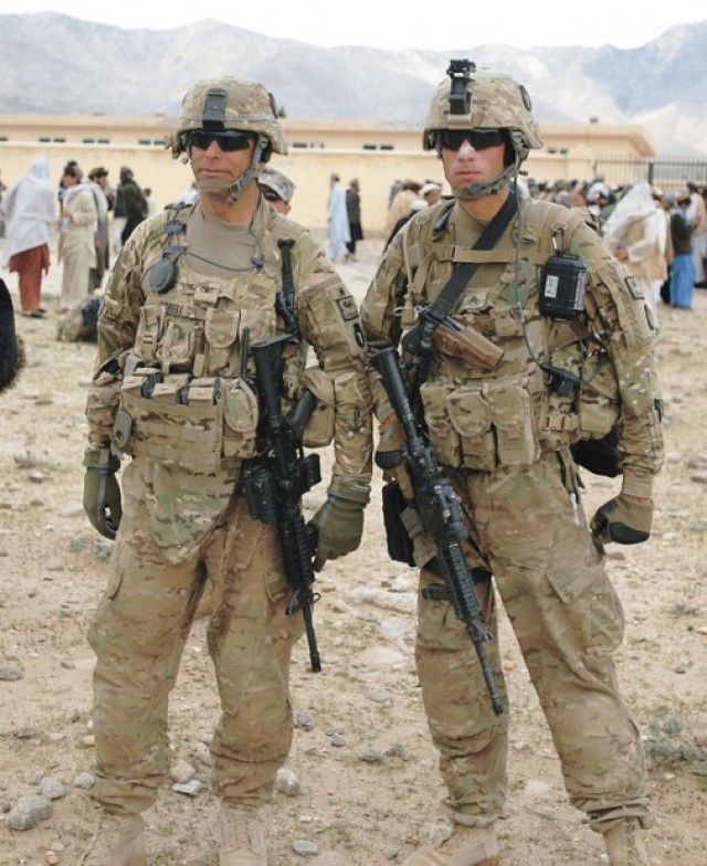 U.S. Army Col. Benjamin J. Corell, left, and his son, Staff Sgt. Wade Corell, a team leader with 1st Battalion, 133rd Infantry Regiment, Task Force Ironman, pose for a photo together. (Courtesy photo)