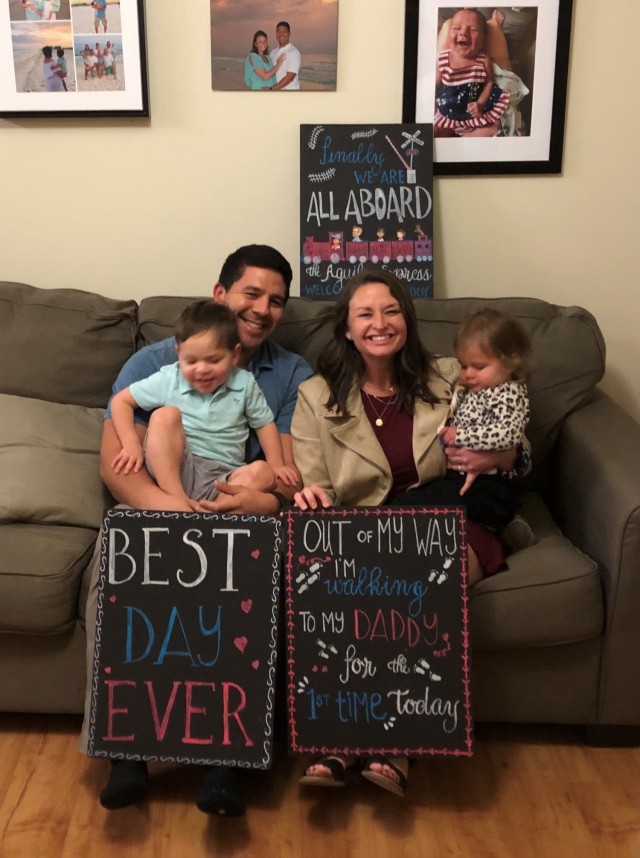 Fort Benning Martin Army Community Hospital Director of Pediatrics Maj. Jessica Aguilar celebrates the homecoming of her husband Family Medicine Residency Faculty Physician Capt. Michael Aguilar from deployment.
