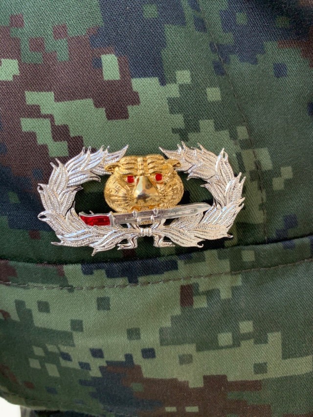 Photographed is the Royal Thai Army Ranger Badge awarded to a Green Beret assigned to 1st Special Forces Group (Airborne) Dec. 29, 2020, in the Kingdom of Thailand. From Oct. 17 to Dec. 29, 2020, he attended the RTA’s Ranger School and earned their Ranger Badge, becoming the first U.S. service member to attend and graduate the course in more than 40 years.