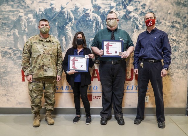 Two Army & Air Force Exchange Service employees were recognized Jan. 6, 2021 for their heroism and quick thinking which saved the lives of two individuals in separate incidents at Fort Huachuca, Arizona. Gidget Rivera, an AAFES service station employee, and Daniel Fox, a supervisor at Popeye’s Fried Chicken, were presented with commander’s coins and certificates from the Garrison Commander, Col. Jarrod Moreland (left), and Exchange General Manager, Jeff Hyatt (right), to acknowledge their customer care and heroism.
