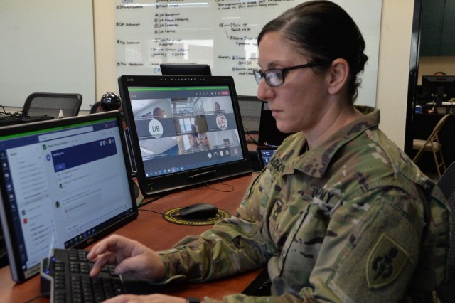 Master Sgt. Catherine Adams, a Master Leader Course facilitator at the NCO Leadership Center of Excellence, works on curriculum and course programming while students engage in dialogue via Microsoft Teams, Dec. 8. While the traditional two-week...