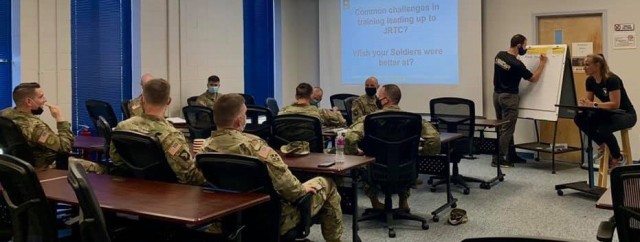 Embedded Performance Experts Kelsey Otten and Mitch Weaver address the key leadership of 1-506 Infantry Regiment before their departure for JRTC. 