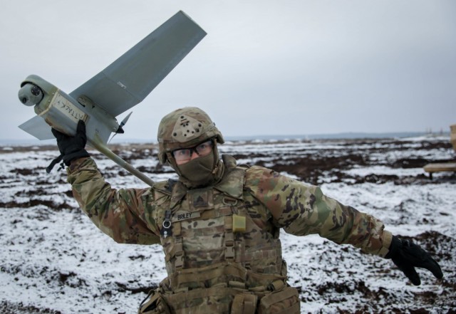 Sgt. Zachary Briley, a Cavalry Scout assigned to 2nd Battalion, 8th Cavalry Regiment, 1st Armored Brigade Combat Team, 1st Cavalry Division, gets ready to launch a drone, commonly called a Raven, Dec. 22, 2020, at the Pabrade Training Area,...