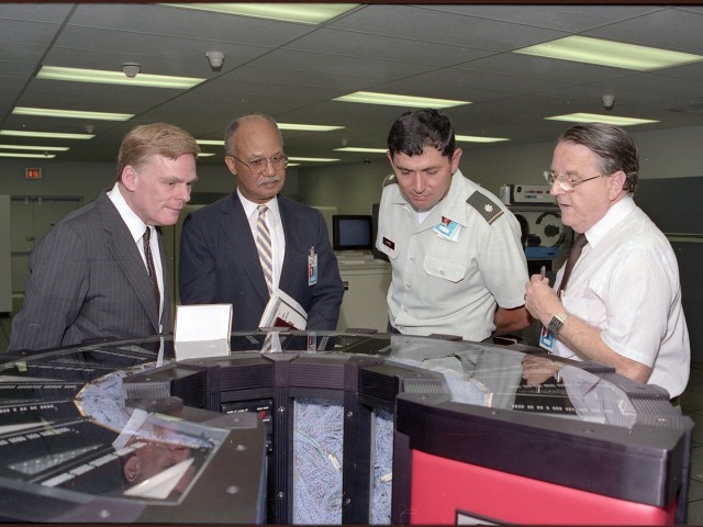 Robert Swint (second from left), a former member of Tank-automotive and Armaments Command’s Senior Executive Service, tours the Research, Development, and Engineering Center (now known as the Ground Vehicle Support Center) at the Detroit Arsenal, Michigan in 1991.  Swint later became the Director of the Integrated Materiel Management Center in 1994. 