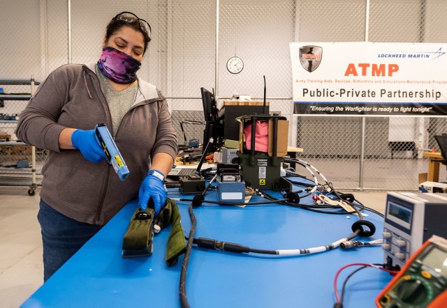 Cleide McLaughlin, electronics mechanic, tests the detector belt for a MILES XXI system.