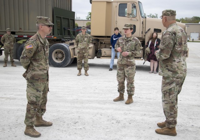 1st Lt. Elizabeth Holland, former platoon leader with the 1133rd Transportation Company, Iowa Army National Guard, recounts the lifesaving actions of Sgt. Timothy Hesse Sr. to Maj. Gen. Ben Corell, Adjutant General of the Iowa National Guard,...