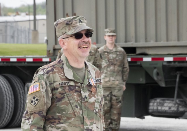 Sgt. Timothy Hesse Sr. smiles after Maj. Gen. Ben Corell, Adjutant General of the Iowa National Guard, pinned on the Iowa Medal of Merit at Camp Dodge Joint Maneuver Training Center on May 13, 2020. On Aug. 15, 2019, Hesse, a motor transport...