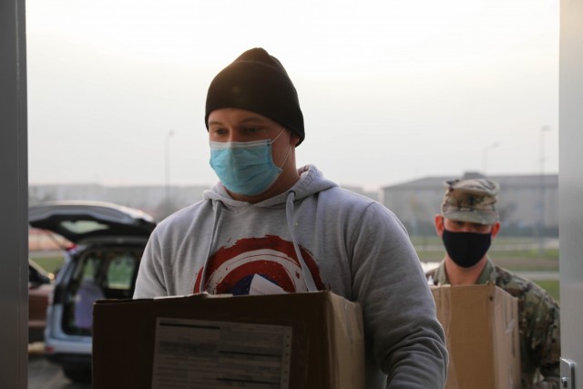 MIHAIL KOGALNICEANU, Romania – Spc. Joshua Smith, Area Support Group-Black Sea, Religious Affairs non-commissioned officer in charge, Alabama National Guard, and Maj. Marshall Chavez, Senior Chaplain, Area Support Group-Black Sea carry gifts...