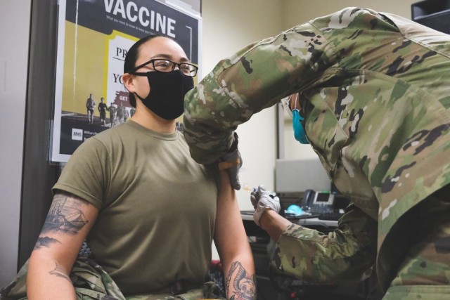 U.S. Army Health Center Vicenza medic Pfc. Brooke Sandoval is the
first active duty Soldier at USAG Italy to receive the COVID-19 vaccine
January 8, 2021 in Vicenza, Italy. 
