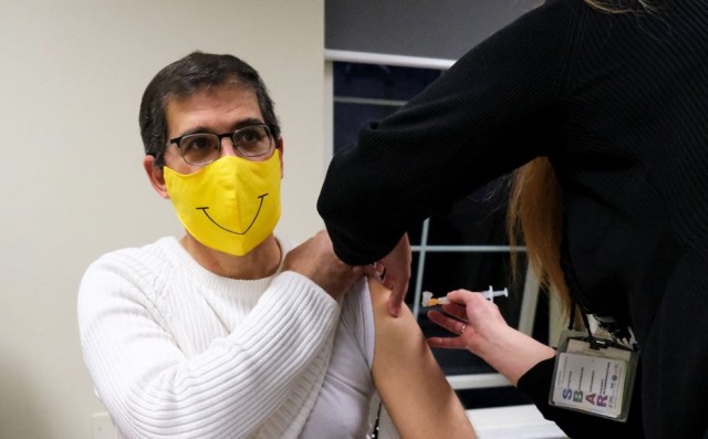 U.S. Army Health Center Vicenza Family Nurse Practitioner  Mark Mollner
receives his COVID-19 vaccine January 8, 2021 in Vicenza, Italy. 
