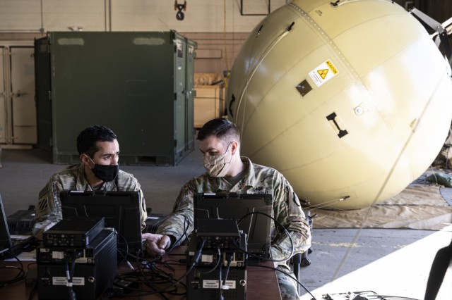 Chief Warrant Officer 2 Nathan Paquette and Chief Warrant Officer 2 Carlos Gil, network management technicians, 4th Space Company, 1st Space Battalion, test a Ground Antenna Transmit and Receive satellite communication terminal at Fort Carson,...