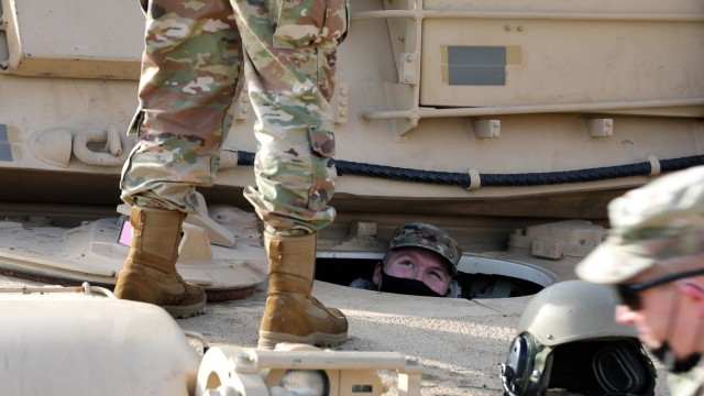 FORT RILEY, KANSAS – Third-year Pittsburg State University Reserve Officer Training Corps cadet Jacob Jasperson peers out of an M1A2 Abrams Tank belonging to the Kansas Army National Guard’s 1st Battalion, 635th Armor Regiment during a visit...