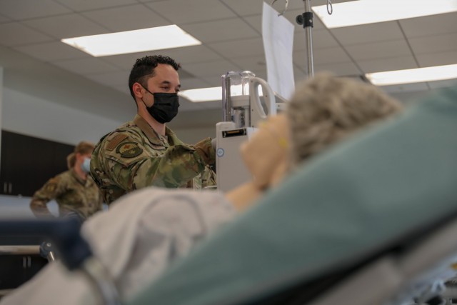 A U.S. Air Force medical provider assigned to Travis Air Force Base, Calif., trains on an Alaris Pump Module for his deployment at the Riverside University Healthcare System on Jan. 7, 2021, in Riverside, California. U.S. Northern Command, through U.S. Army North, remains committed to providing flexible U.S Department of Defense support to the whole-of-America COVID-19 response. (U.S. Army Photo by Spc. Preston Robinson)
