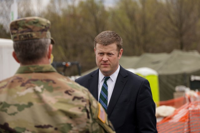 Army Secretary Ryan D. McCarthy speaks with Maryland Adjutant General Maj. Gen. Timothy Gowen while visiting a COVID-19 screening site in Landover, Md., in this file photo from March 31, 2020.