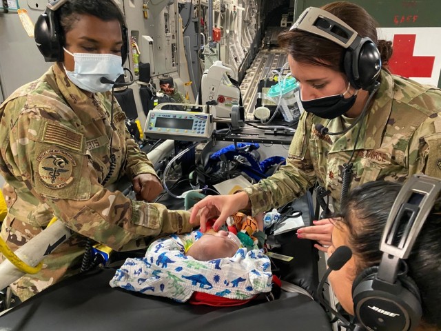 A 59th Medical Wing Pediatric Critical Care Air Transport Team provides care to a five-month-old patient on board a C-17 Globemaster III headed to California, Oct. 9, 2020. The patient and his family were traveling from the neonatal intensive care...
