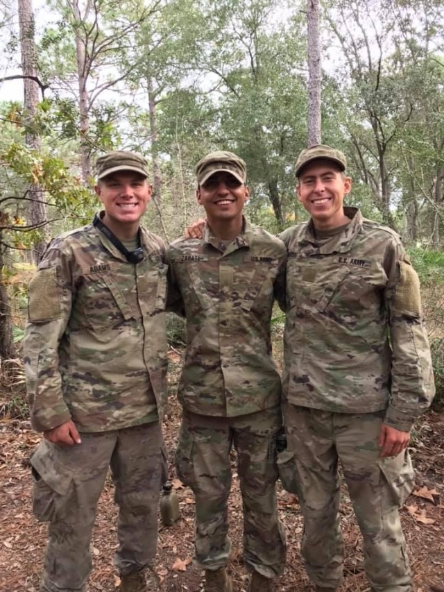 (L-R) Spc. Blayne Adams, Sgt. 1st Class Miguel Zarate and Spc. Carl Siberski pose in this undated photo at Fort Benning, Georgia. The three Soldiers are all assigned to 1st Battalion, 64th Armor Regiment, 1st Armored Brigade Combat Team, 3rd Infantry Division and graduated Ranger School together Nov. 12, 2020. The COVID-19 pandemic added a layer of difficulty to the already grueling school, known as one of the Army’s most challenging leadership courses.