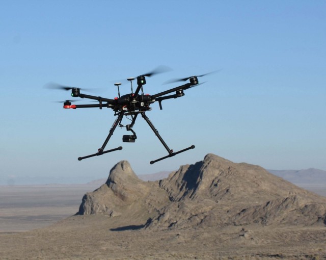A small unmanned aircraft system (sUAS) is shown in flight at Dugway Proving Ground. The sUAS is one of three platforms utilized during the two-year project to locate golden eagle nests on the installation.
Dugway Proving Ground photo. 