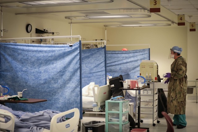 U.S. Navy Lt. Kathryn Hrezo, a critical care nurse with the Rural Rapid Response Team, prepares to checks patients’ blood sugar levels, while working in the COVID-19 ward at the Northern Navajo Medical Center, Shiprock, N.M., Jan. 2, 2021.  U.S....