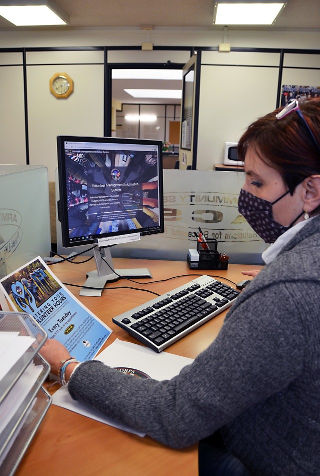 VICENZA, Italy - Army Community Service staff member Simona Bryant focuses on how to access and enter information into the modernized Volunteer Management Information System (VMIS) site Jan. 12, 2021....