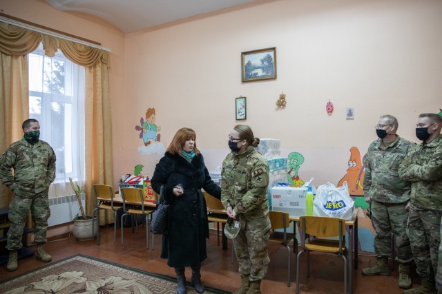 School director Natalia Frankiv thanks Task Force Illini Soldiers for donating supplies to the Krakovets Rehabilitation Center for Children with Disabilities in Krakovets, Ukraine, Jan. 11. (U.S. Army Photo, Cpl. Shaylin Quaid)