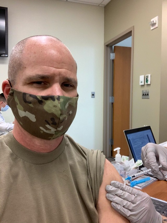Col. Clinton K. Murray, Commander of the Walter Reed Army Institute of Research, receives his second dose of a COVID-19 vaccine at the Walter Reed National Military Medical Center.