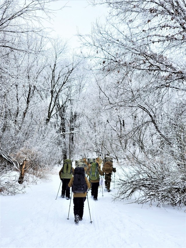 Students in Cold-Weather Operations Course Class 21-01 practice snowshoeing and pulling ahkio sleds with gear as teams Jan. 7, 2021, near Whitetail Ridge Ski Area in Pine View Recreation Area at Fort McCoy, Wis. The course covers a variety of...