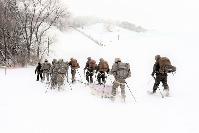 Students in Cold-Weather Operations Course Class 21-02 practice snowshoeing and pulling ahkio sleds with gear as teams Jan. 7, 2021, near Whitetail Ridge Ski Area in Pine View Recreation Area at Fort McCoy, Wis. The course covers a variety of...