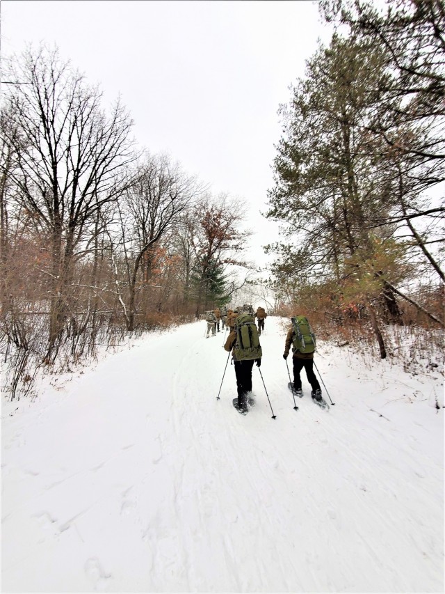 Students in Cold-Weather Operations Course Class 21-01 practice snowshoeing and pulling ahkio sleds with gear as teams Jan. 7, 2021, near Whitetail Ridge Ski Area in Pine View Recreation Area at Fort McCoy, Wis. The course covers a variety of...