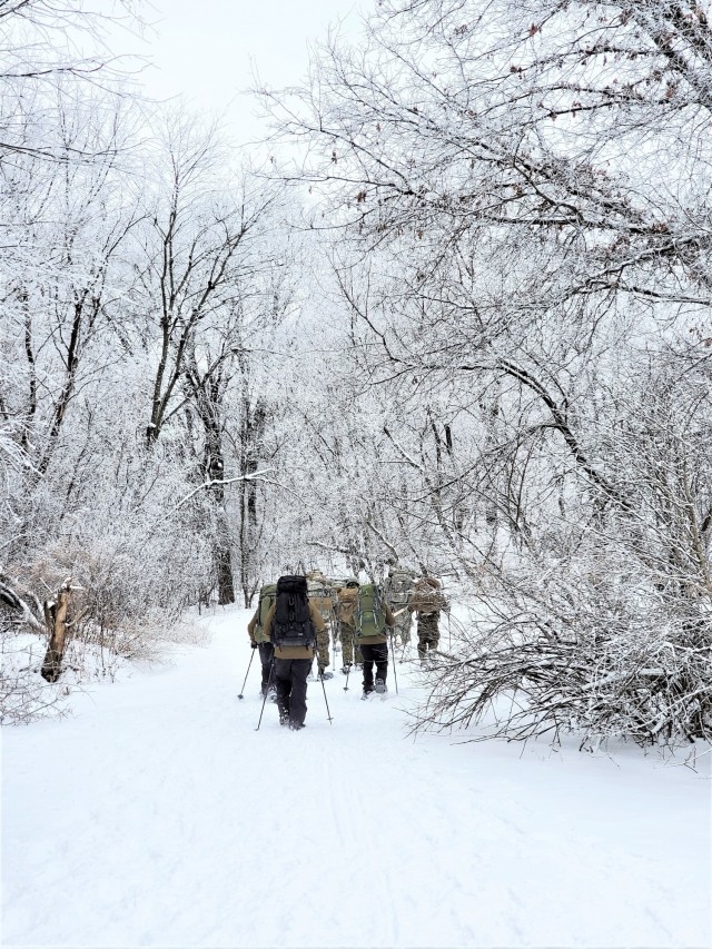 Students in Cold-Weather Operations Course Class 21-01 practice snowshoeing and pulling ahkio sleds with gear as teams Jan. 7, 2021, near Whitetail Ridge Ski Area in Pine View Recreation Area at Fort McCoy, Wis. The course covers a variety of...