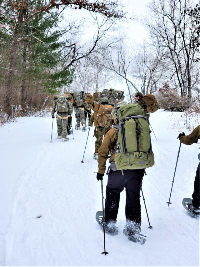 Students in Cold-Weather Operations Course Class 21-01 practice snowshoeing and pulling ahkio sleds with gear as teams Jan. 7, 2021, near Whitetail Ridge Ski Area in Pine View Recreation Area at Fort McCoy, Wis. The course covers a variety of...