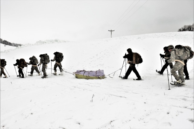 Students in Cold-Weather Operations Course Class 21-02 practice snowshoeing and pulling ahkio sleds with gear as teams Jan. 7, 2021, near Whitetail Ridge Ski Area in Pine View Recreation Area at Fort McCoy, Wis. The course covers a variety of...