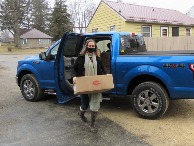 Fort McCoy, Wis., personnel and Soldiers with Headquarters and Headquarters Company (HHC), Fort McCoy Garrison, are shown after they traveled to Couleecap Monroe County Food Pantry in Sparta, Wis., on Dec. 21, 2020 for the third and final drop-off...