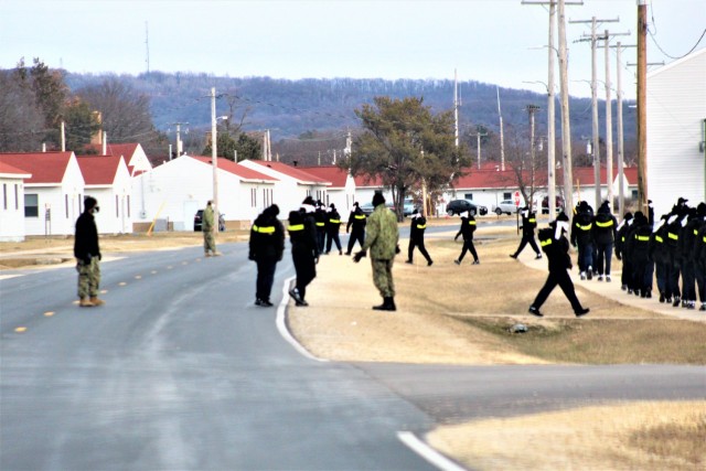 U.S. Navy recruits walk on the cantonment area Dec. 15, 2020, at Fort McCoy, Wis. The Navy’s Recruit Training Command (RTC) of Great Lakes, Ill., worked with the Army at Fort McCoy so the post could serve as a restriction-of-movement (ROM) site...