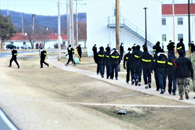 U.S. Navy recruits walk on the cantonment area Dec. 15, 2020, at Fort McCoy, Wis. The Navy’s Recruit Training Command (RTC) of Great Lakes, Ill., worked with the Army at Fort McCoy so the post could serve as a restriction-of-movement (ROM) site...
