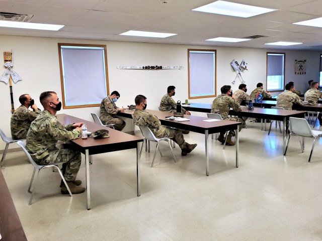 Students participate in a class as part of the Fort McCoy Cold-Weather Operations Course on Dec. 4, 2020, at Fort McCoy, Wis. This was the first day for class 21-01 to be in session. The course is coordinated by the Fort McCoy Directorate of Plans, Training, Mobilization and Security to teach service members better skills to operate in cold weather. (U.S. Army Photos by Scott T. Sturkol, Public Affairs Office, Fort McCoy, Wis.)