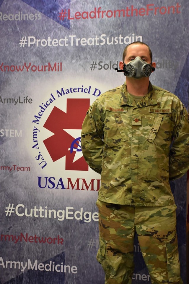 U.S. Air Force Maj. Daniel Williams demonstrates the fit of an N95 elastomeric half-mask respirator. Williams serves as product manager of the Warfighter Expeditionary Medicine and Treatment Project Management Office's N95 respirator efforts at the U.S. Army Medical Materiel Development Activity. (Photo by Jeffrey Soares, USAMMDA public affairs)
