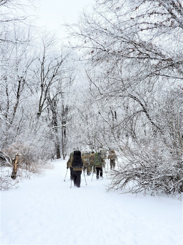 Students in Cold-Weather Operations Course Class 21-01 practice snowshoeing and pulling ahkio sleds with gear as teams Jan. 7, 2021, near Whitetail Ridge Ski Area in Pine View Recreation Area at Fort McCoy, Wis. The course covers a variety of...