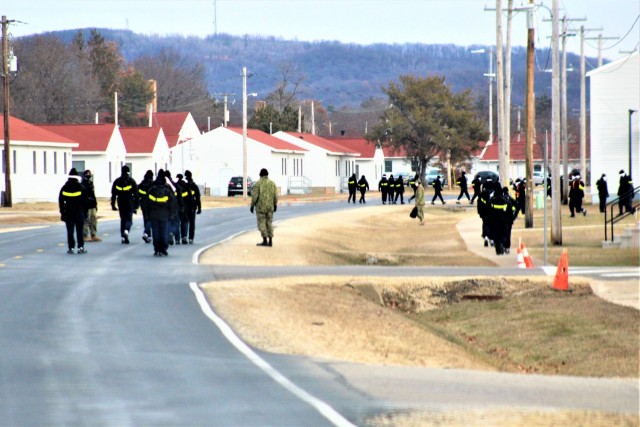 U.S. Navy recruits walk on the cantonment area Dec. 15, 2020, at Fort McCoy, Wis. The Navy’s Recruit Training Command (RTC) of Great Lakes, Ill., worked with the Army at Fort McCoy so the post could serve as a restriction-of-movement (ROM) site...