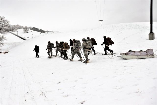 Students in Cold-Weather Operations Course Class 21-01 practice snowshoeing and pulling ahkio sleds with gear as teams Jan. 7, 2021, near Whitetail Ridge Ski Area in Pine View Recreation Area at Fort McCoy, Wis. The course covers a variety of...