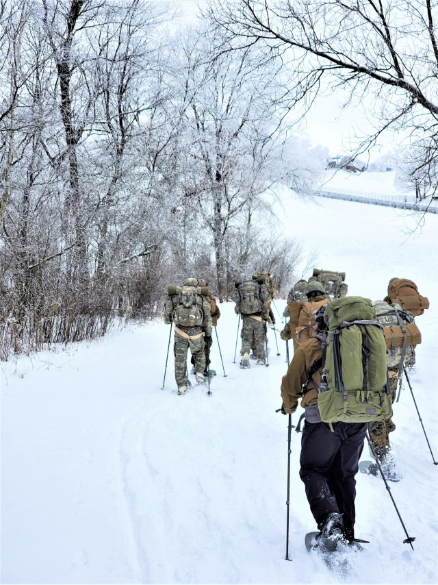 Students in Cold-Weather Operations Course Class 21-01 practice snowshoeing and pulling ahkio sleds with gear as teams Jan. 7, 2021, near Whitetail Ridge Ski Area in Pine View Recreation Area at Fort McCoy, Wis. The course covers a variety of...