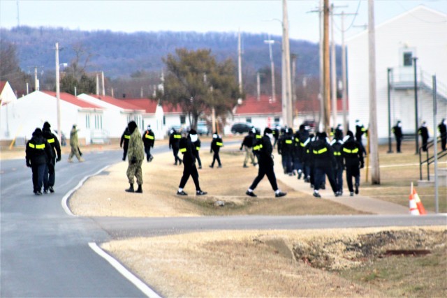 U.S. Navy recruits walk on the cantonment area Dec. 15, 2020, at Fort McCoy, Wis. The Navy’s Recruit Training Command (RTC) of Great Lakes, Ill., worked with the Army at Fort McCoy so the post could serve as a restriction-of-movement (ROM) site...