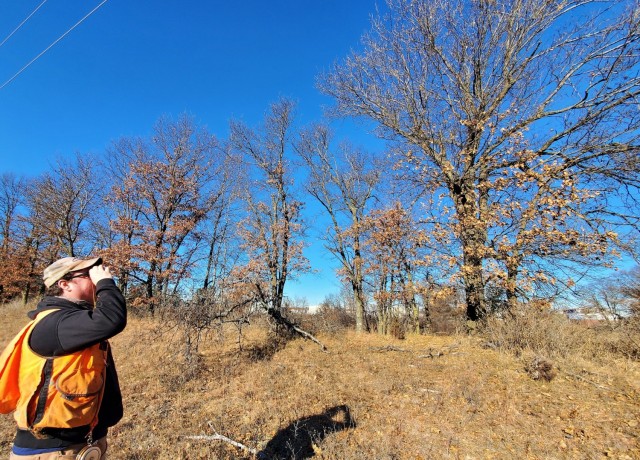 Forestry Technician Nick Randall uses a clinometer to measure the height of a tree while working on a forestry survey on the cantonment area Dec. 4, 2020, at Fort McCoy, Wis. Parry works with the Forestry Office of the Directorate of Public Works...