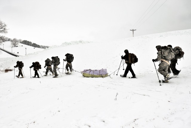 Students in Cold-Weather Operations Course Class 21-02 practice snowshoeing and pulling ahkio sleds with gear as teams Jan. 7, 2021, near Whitetail Ridge Ski Area in Pine View Recreation Area at Fort McCoy, Wis. The course covers a variety of...