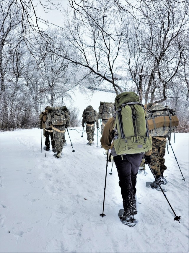 Students in Cold-Weather Operations Course Class 21-01 practice snowshoeing and pulling ahkio sleds with gear as teams Jan. 7, 2021, near Whitetail Ridge Ski Area in Pine View Recreation Area at Fort McCoy, Wis. The course covers a variety of...